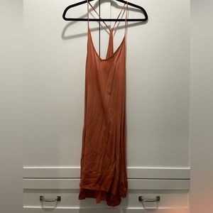 This is a great sundress. Burnt orange color. Flows nicely. Beautiful thin strap